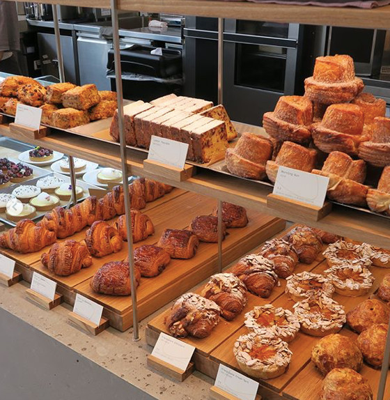 A display case showing many delicious varieties of pastries