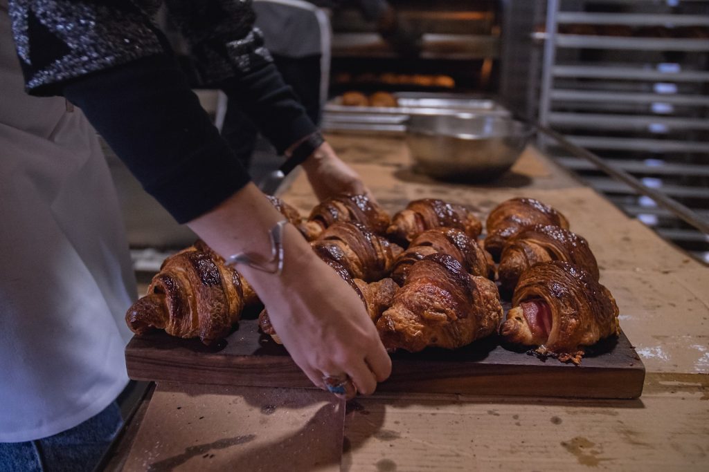 A tray of croissants being prepared for service