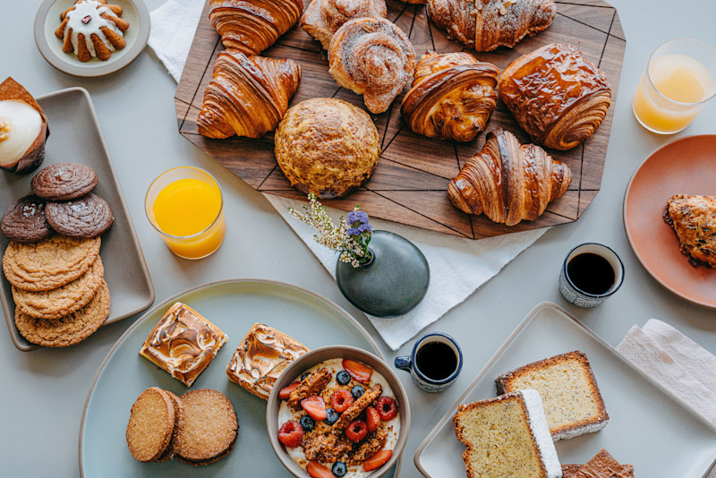 A spread of breads, pastries, and cookies