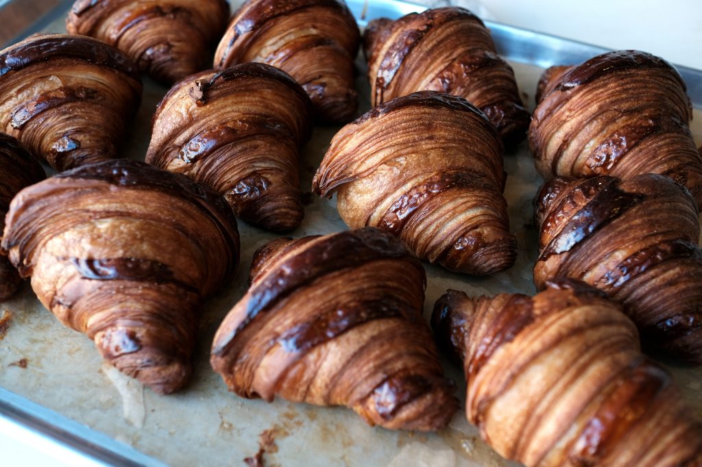 A tray of mouthwatering croissants awaits the breakfast croud