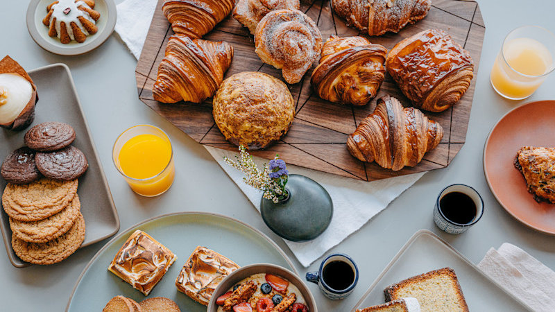 A spread of breads, pastries, and cookies