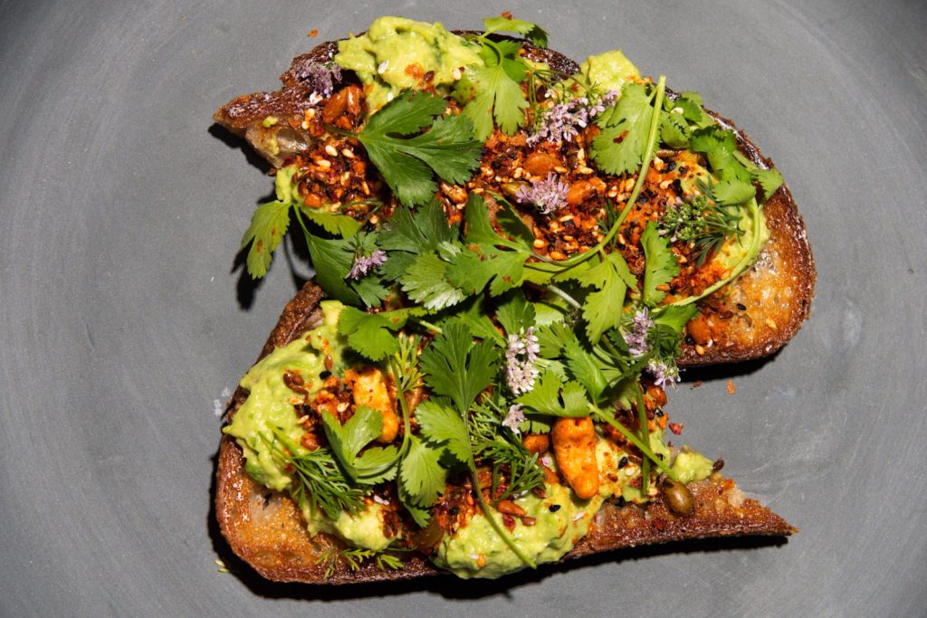 Two slices of avocado toast prepared by our Pasadena location
